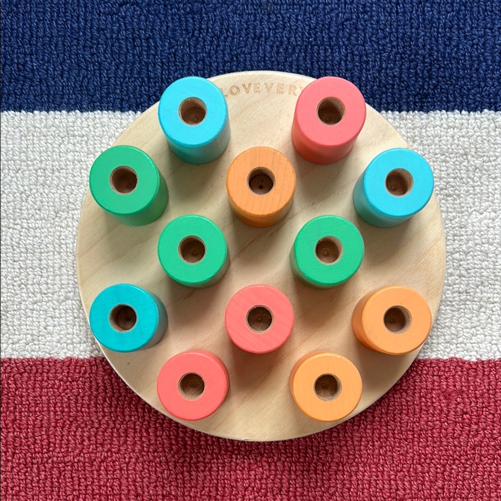 Lovevery wooden stacking pegboard